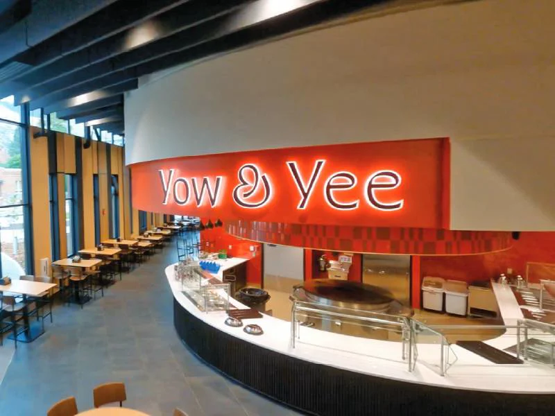 An image of the Yow and Yee lit up interior signage.
